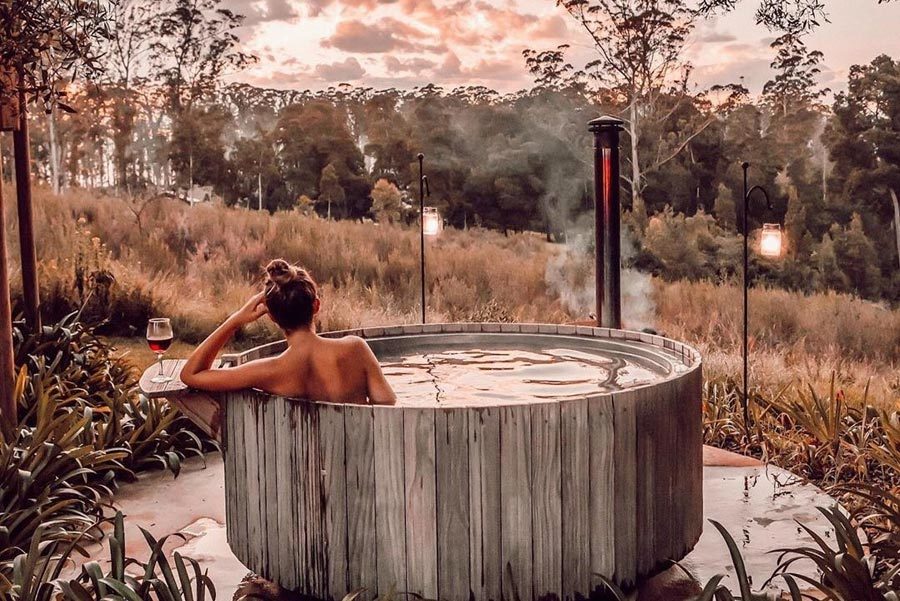 girl-in-hot-tub-on-africamps-oakhurst-wilderness